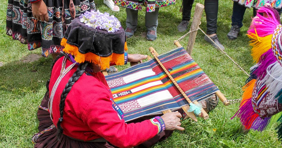 Local Andean artisan demonstrating traditional weaving in the Sacred Valley
