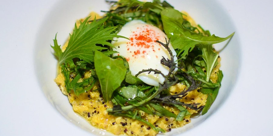 Modern Quinoa Quinotto dish with a poached egg